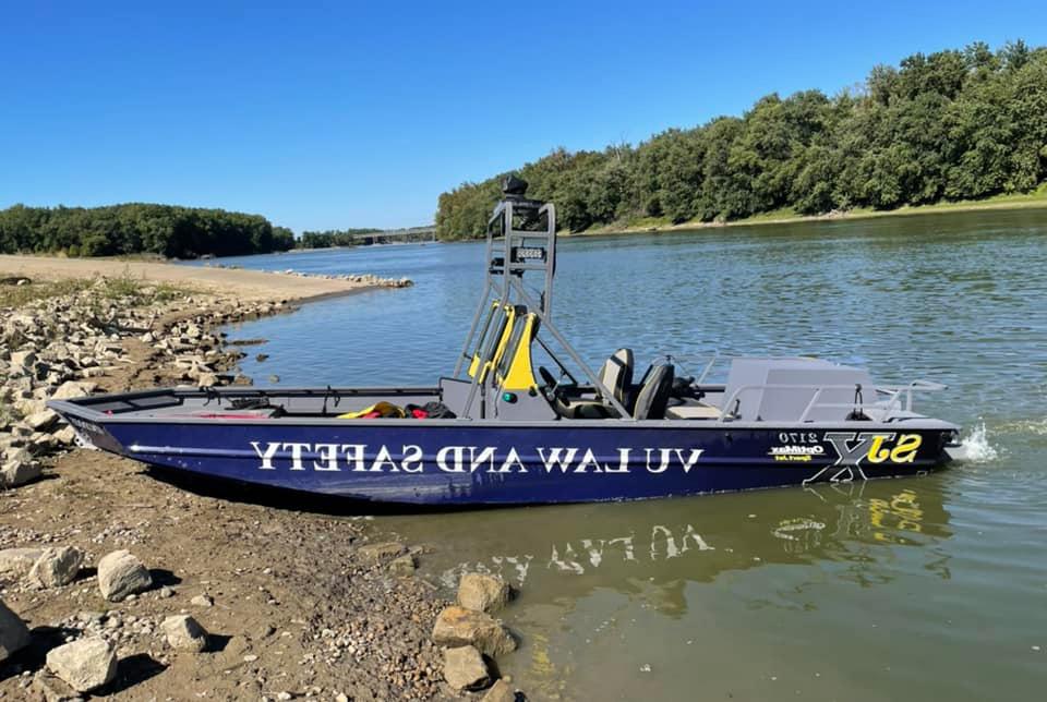 Conservation Law boat on beach.